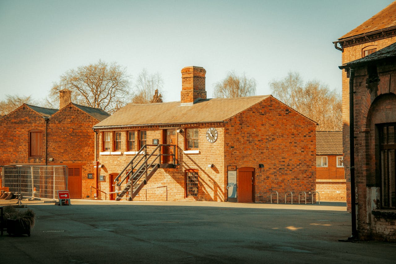 An outdoor view of a historic industrial brick building in Shrewsbury, England.